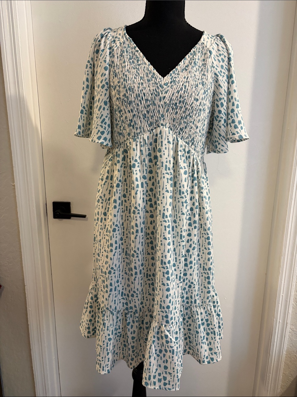 Jodifl babydoll dress with white and blueish green pattern size medium